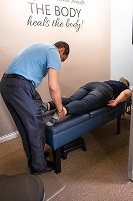 Chiropractor Virginia Beach VA Adjusting Legs