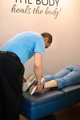 Chiropractor Virginia Beach VA Michael Vanella Adjusting Legs