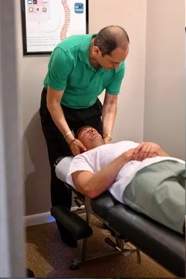 Chiropractor Virginia Beach VA Michael Vanella Adjusting Neck